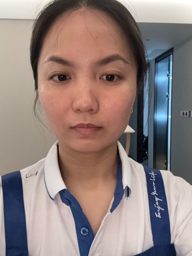 Straight-on uploaded selfie with a simple background